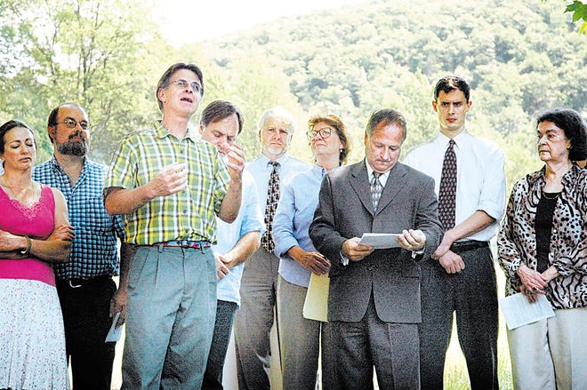 Orange County Legislator Wayne Decker, third from left, speaks at a news conference yesterday at which the county announced its commitment to spend $1.3 million to preserve about 500 more acres of farmland