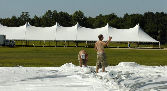 Tent company workers were busy all day Thursday setting up tents at Middleboro High School fields for Saturday’s special town meeting on the casino.