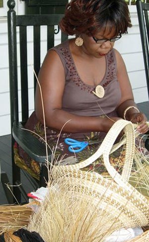 Henrietta Snype, 55, works on a sweetgrass basket at the at the Charles Pinckney National Historic Site managed by the National Park Service Tuesday, July 10, 2007 in Mount Pleasant, S.C. Snype continues to hand down the tradition to her children and teaches the craft to students but booming coastal development has made finding the clumps of long, swaying sweetgrass tougher and tougher. The shortage is threatening the centuries-old black American folk art. (AP Photo/Evan Berland)