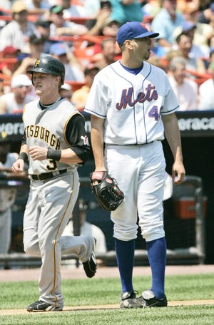 New York Mets pitcher Oliver Perez (46) reacts as Pittsburgh Pirates' Nate McLouth (3) scores on Perez's throwing error during the sixth inning of baseball action Thursday, July 26, 2007 at Shea Stadium in New York. (AP Photo/Frank Franklin II)