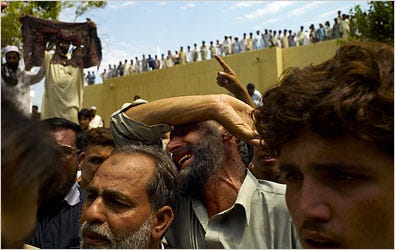 Hundreds of angry protesters clashed with the police on Friday when the Pakistani government tried to reopen the Red Mosque for prayers.