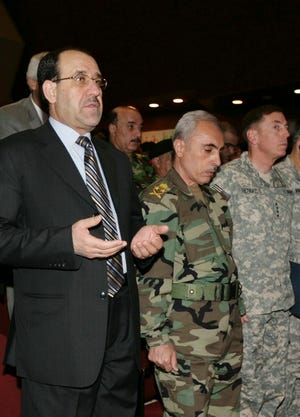 Iraqi Prime Minister Nouri al-Maliki , left; Iraqi army chief of staff Babakir Zebari, center; and Gen. David Petraeus, the top U.S. commander in Iraq, attend a conference held with Iraqi army officials on June 6.