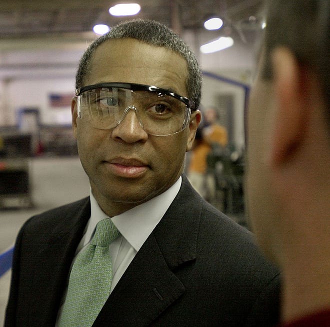 Gov. Deval Patrick visits with a Cybex employee Monday in Medway during a tour of the plant.