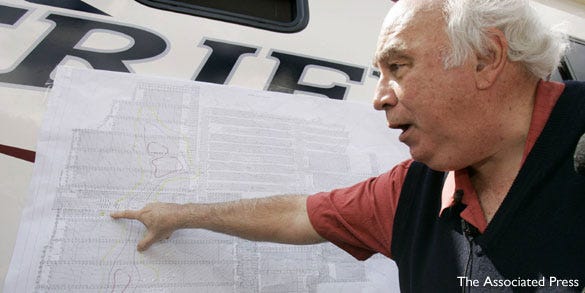 Robert E. Murray, founder and chairman of Cleveland based Murray Energy Corp, points on a map to where six trapped coal miners are believed to be at at the entrance to his Crandall Canyon Mine on Monday, northwest of Huntington, Utah.