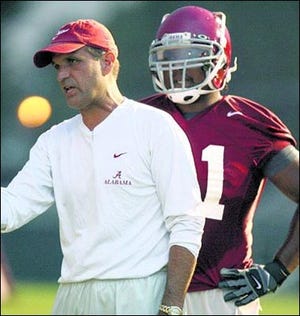 University of Alabama defensive coordinator Kevin Steele goes over instructions with linebacker Prince Hall during a recent Crimson Tide practice.