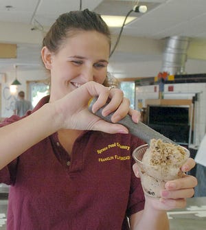 Jane Ross scoops a bowl of ice cream at Spruce Pond Creamery at Franklin Flatbreads Tuesday in Franklin.