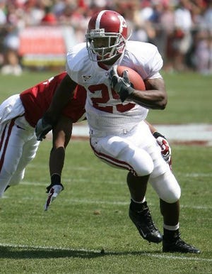 Running back Terry Grant (29) rips off yardage during the A-Day game in April. Head coach Nick Saban said Tuesday that Grant has “done very well.”
