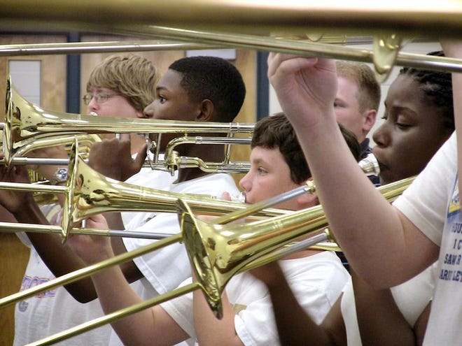 Winter Haven High School Band members rehearse recently in the school's band room.