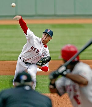 Red Sox pitcher Clay Buchholz fires a pitch in the first inning of his major league debut against the Angels at Fenway Park.
