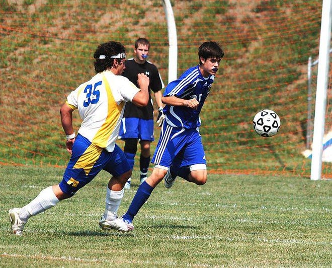 Ray Mongeau photo

Franklin's Nate Kaplan, right, and Gilford's Ethan Simoneau, left, battle for control of the ball during Saturday's Class M soccer battle. Gilford cruised to a 9-1 win.