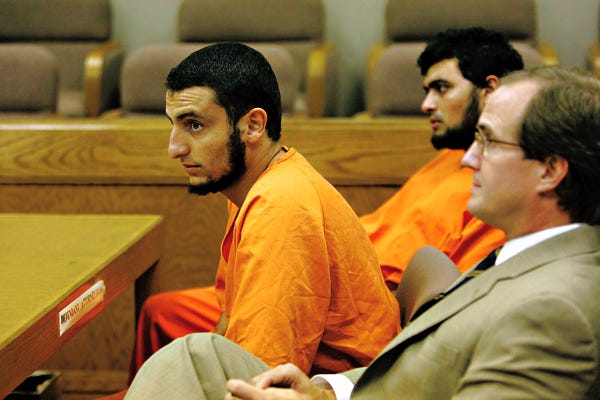 From left, Youssef Samir Megahed, Ahmed Abdellatif Sherif Mohamed and attorney Dennis Rhoad, seen Aug. 6.