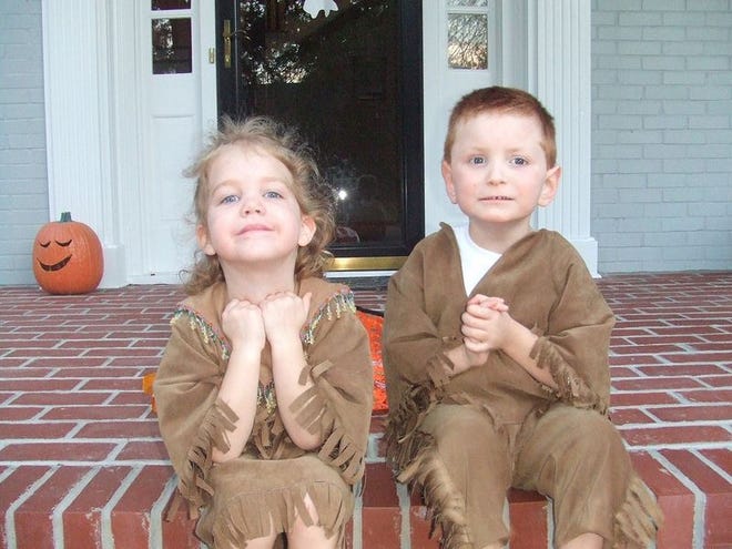 Harley (right) and his sister, Anna, pose for a picture in their Halloween costumes last year.