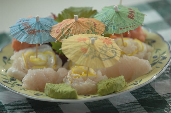 A plate of sushi made from black sea bass sits ready to be eaten Thursday during a blind taste test at the Skidaway Institute of Oceanography. Black sea bass raised on tilapia was tested against bass fed food pellets and ones caught fresh from the ocean.
