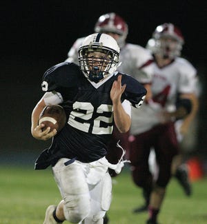 Apponequet's Jack Gaynor carries the ball against Carver.