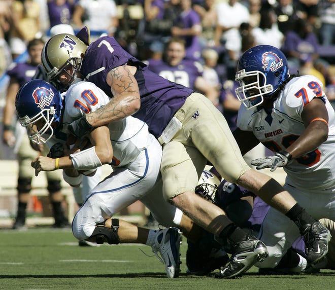 Boise State quarterback Taylor Tharp is sacked by Washington defensive end Greyson Gunheim. It was that kind of day for the Broncos, who had their 14-game winning streak snapped.