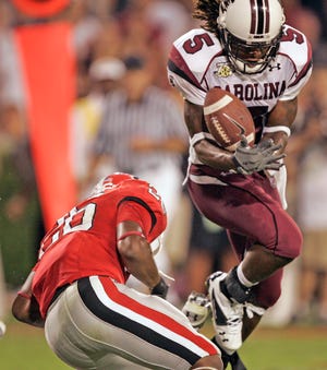 South Carolina's Stephen Garcia breaks up a pass in the end zone that was intended for Georgia's Tony Wilson in the final minutes Saturday. South Carolina won 16-12. (AP Photo/John Bazemore)