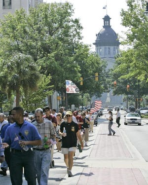 Freedom Walkers march down Main Street from the Statehouse in Columbia in remembrance of the Sept. 11, 2001, attacks that killed 2,974 in New York, at the Pentagon and in Pennsylvania.