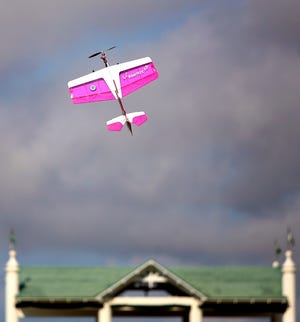 A model airplane soars over the Villages Polo Club.