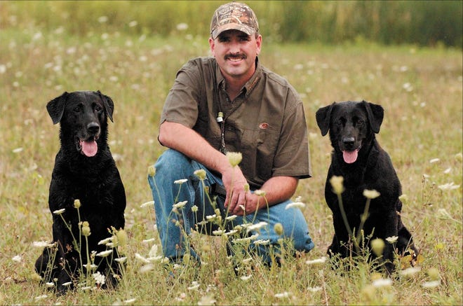 Tim Miles of Phelps will compete with Razor, left, and Rosey in the AKC Master National Hunting Dog Championship Oct. 14 in Virginia. He works with them more than two hours a day to prepare them.