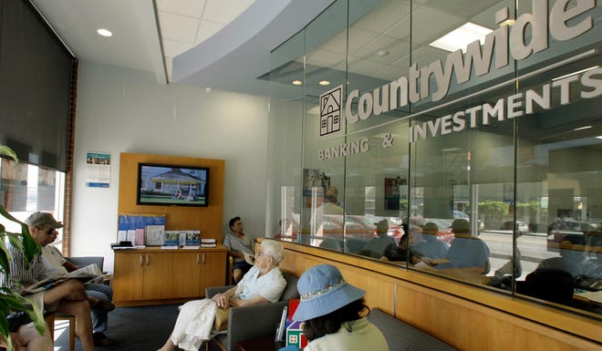 **FILE** Countrywide Financial Corp. customers wait in the lobby of a Los Angeles branch, in this Aug. 20, 2007 file photo. Countrywide Financial Corp. grew from a two-man startup in 1969 to become the nation's leading mortgage lender by deftly riding out housing boom-and-bust cycles. But the current cycle has forced the company to borrow billions of dollars, cut thousands of jobs and dramatically restructure its lending practices. (AP Photo/Nick Ut, File)