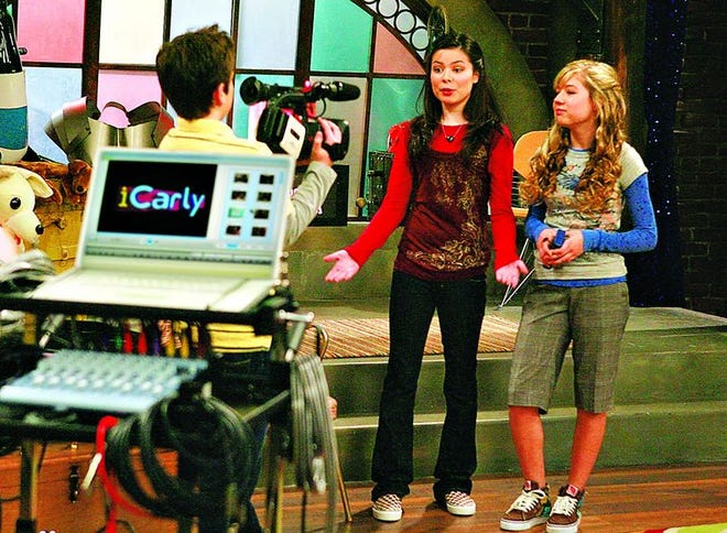 Cast members of the new teen series "iCarly," from left, Nathan Kress as Freddy, Miranda Cosgrove as Carly and Jennette McCurdy as Sam, perform in a scene from the sitcom about kids putting on a webcast from bits of outrageous video they collect from the Web.
