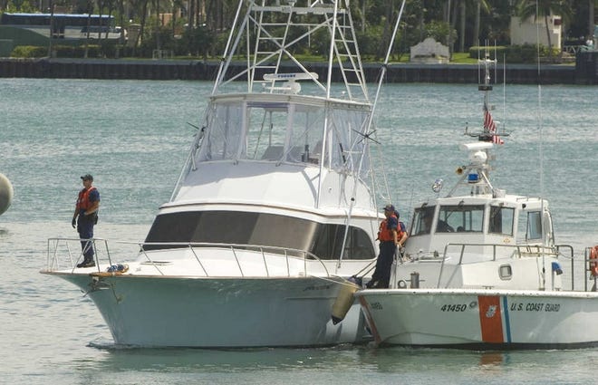 The “Joe Cool” is towed into Miami Beach.