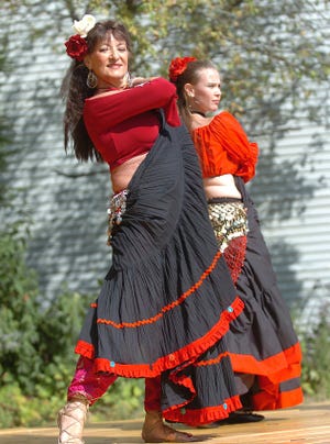 At front, Gypsy Phillips of Northborough dances with the "Velvet Moon Gypsies", at Marlboroug's Heritage Festival.