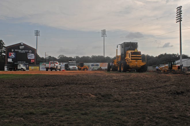 Graders work in the infield area at Grayson Stadium to up grade drainage and irrigation.