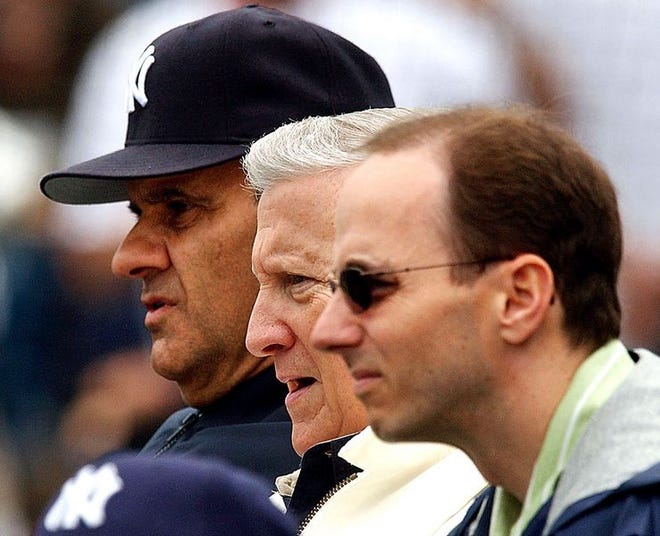 Yankees' owner George Steinbrenner (center) may have an unhappy clubhouse to deal with if he fires Joe Torre.