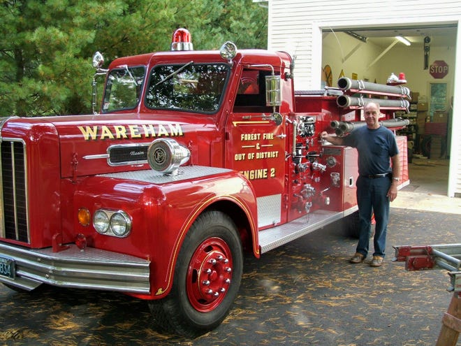 Howard Smith stands next to the fire truck he received as a 25th wedding anniversary gift 15 years ago. It is the first truck Howard rode in when he became a firefighter 43 years ago at the age of 16.  The truck will make its first debut since being restored at this weekend's Wareham Fire District Centennial Celebration Parade. In an ironic twist, it will also be the Smith's 40th wedding anniversary the day of the parade.