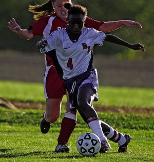 Candace Marshall of Bridgewater-Raynham makes a move against Barnstable.
