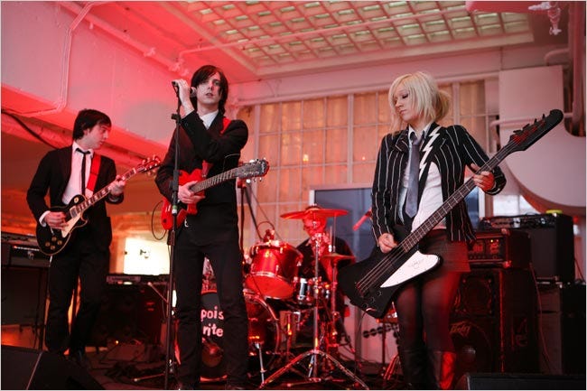 A post-punk band performing at the Polish Cultural Institute in London. Many of the immigrants surmount language difficulties.