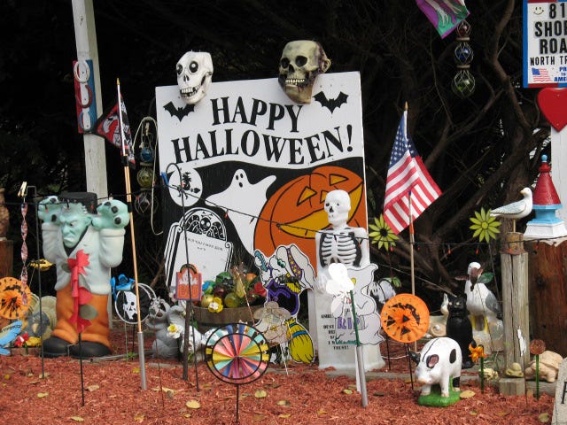 These ghouls and goblins on Shore Road extend Halloween greetings to passing traffic.