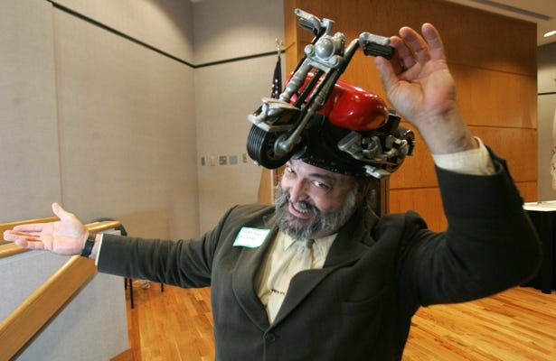 Randall Flann of Milwaukee was one of the more colorful presenters Oct. 24 at NIU Rockford at the Stateline Fast Pitch Competition. His product is called RoFo Head Gear, which is a beverage dispenser.