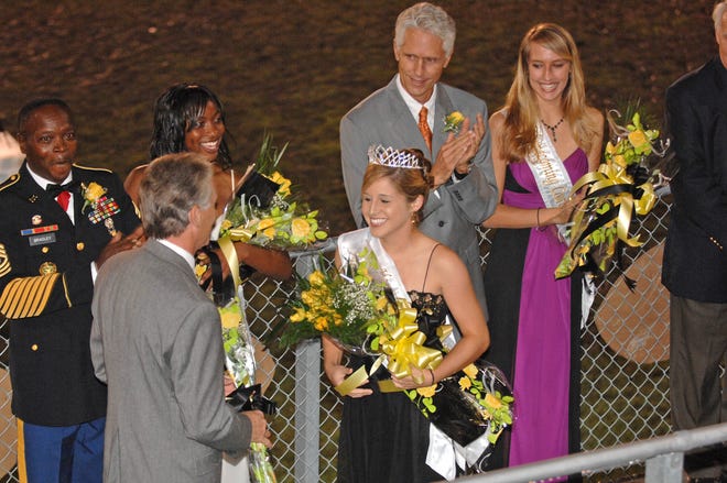 Center: 2007 RHHS Homecoming Queen Lauren Hall is congratulated by her father Bill; at left is second runner-up Lovetta Bradley and her father Charles; at right is first runner-up Katie Hudson and her father Steve.