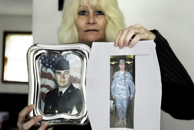 Lori Pelfrey holds photos of her two sons that were brought from overseas after her apartment burned down. Her two sons posted an ad on Craigslist, soliciting help for their mother in the form of clothes and furniture donations. Many people thought it was a hoax and offered no help.