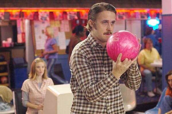 Ryan Gosling plays Lars, a shy young man who buys a doll to be his girlfriend, in “Lars and the Real Girl.” Kelli Garner, in background, plays a woman who’s attracted to Lars.