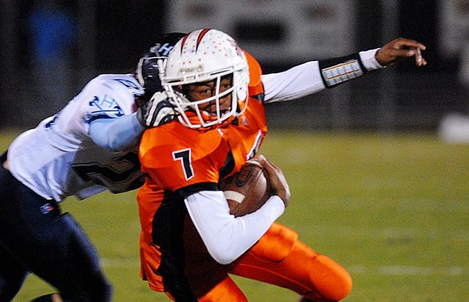 Hoggard's Ian Shankland brings down New Hanover's Jermaine Jones during their match at Legion Stadium on Friday, November 2, 2007. Shankland was called for a facemask. Hoggard defeated New Hanover 21-0. PHOTO BY MICHAEL HENNINGER/WILMINGTON STAR-NEWS