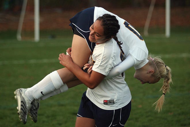 After earning a 2-0 victory over Whitinsville Christian in Monday afternoon’s Central Mass. Division 3 quarterfinal game, Littleton’s Sonia Basma lifted teammate Logan Becker over her shoulder to celebrate the victory. The second-seeded Tigers will now play either Bromfield or St. Mary’s tonight (5 p.m.) in Hudson.