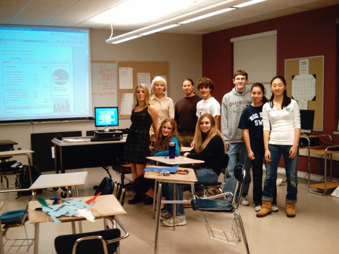 Jon Flanagan and Anita Balliro with students in the new ‘Community Service Resource Room’ at Swampscott High School. The school has devoted time and space to developing students in all areas: academically, physically and as responsible members of the community.