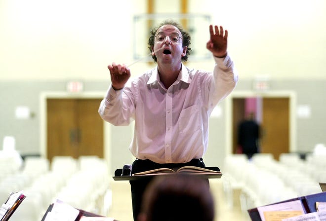 Conductor Peter Freisinger leads his crew during the Parkway Orchestra's rehearsal before their concert at St. Theresa School on Sunday afternoon, November 4, 2007.