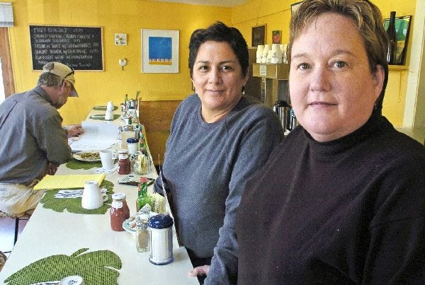 Chach Briseno, left, and Sharon Bowes, at Chach’s in Provincetown, expressed concern about the arson fires.