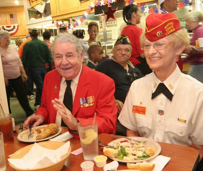Ben DeLuca and Gayle Fell enjoy a free meal Monday at Golden 
Corral in 
Spartanburg. The meal is an annual gesture by the 
restaurant to honor veterans.