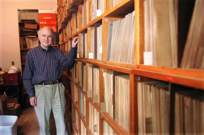 Timothy Brooks stands Oct. 25, 2007, near his collection of 10,000 78 rpm records in his Greenwich, Conn., garage.