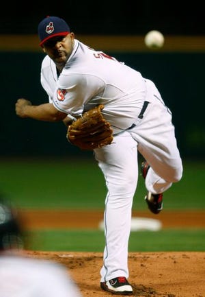 Cleveland Indians' C.C. Sabathiav pitches against the Boston Red Sox in the first inning of Game 5 of the American League Championship baseball series Oct. 18 in Cleveland. Sabathia won the AL Cy Young Award yesterday. He topped Sox pitcher Josh Beckett for the award.