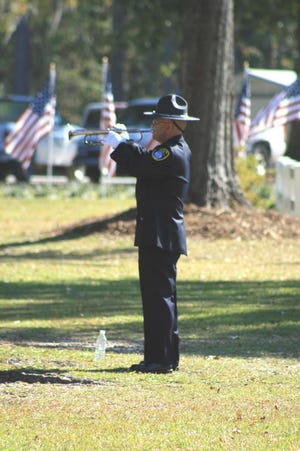 Tim Saia of the RHPD played Taps at the conclusion of the ceremony. (Jamie Parker/Bryan County Now)