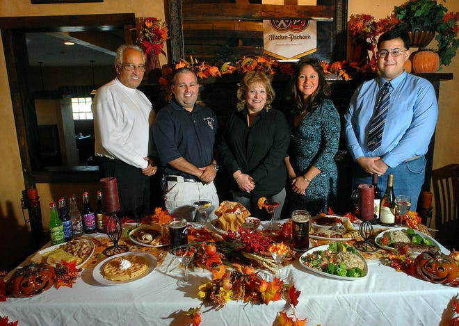 Hudson's Horseshoe Pub will be among 30 restaurants participating in the annual "Evening of Giving" event at the Best Western in Marlborough. From left, owners Al and Nick Pizzimento, committee member Aura Gauthier, committee Chairwoman Ivette Mesmar and volunteer Jose Mazmar.