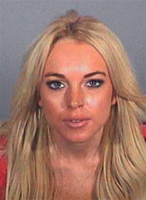 This booking photo provided by the Los Angeles County Sheriff's Department shows Lindsay Lohan. A Sheriff's spokesman said Lohan surrendered to the Los Angeles County women's detention center in Lynwood at 10:30 a.m. Thursday Nov. 15, 2007, to serve a one-day sentence for drunken driving. She was searched, fingerprinted and placed in a holding cell in the inmate reception area but got to keep her street clothes.