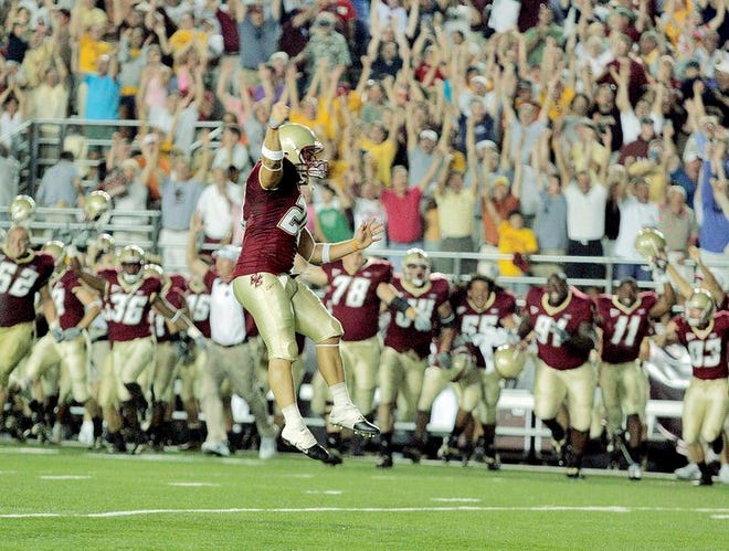 Boston College kicker Ryan Ohliger leaps in the air as he celebrates his game-winning extra point kick to beat Clemson in double overtime last season.
