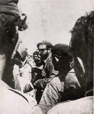 Cuban dictator Fidel Castro (center) directs operations in the field during the Bay of Pigs invasion, in this photo published originally in the April 22, 1961, edition of the Cuban government newspaper Revolucion. Almost half a century after the 1959 overthrow of the Cuban government under Fulgencio Batista, Cuba may be prepared for more open relations with America.